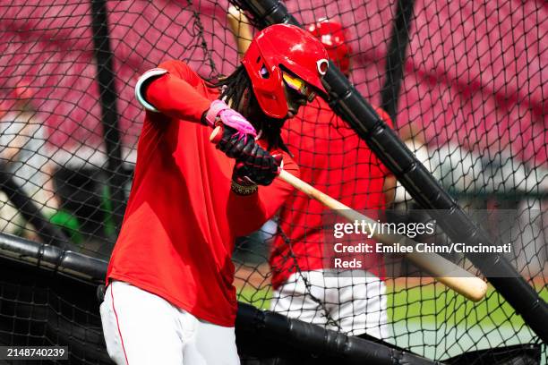 Elly De La Cruz of the Cincinnati Reds wears Solar Eclipse glasses during batting practice before a game against the Milwaukee Brewers at Great...