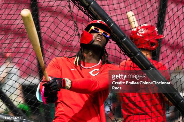 Elly De La Cruz of the Cincinnati Reds wears Solar Eclipse glasses during batting practice before a game against the Milwaukee Brewers at Great...