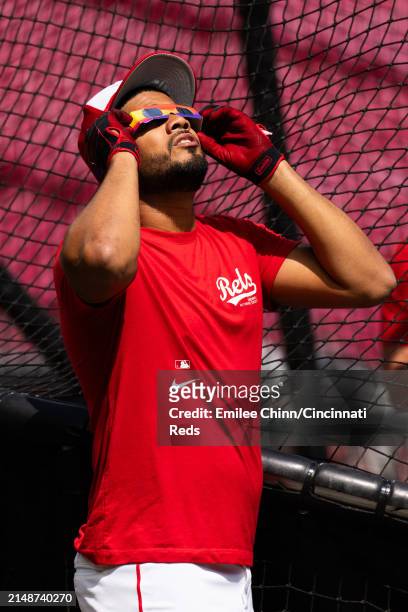 Jeimer Candelario of the Cincinnati Reds watches the Solar Eclipse before a game against the Milwaukee Brewers at Great American Ball Park on April...
