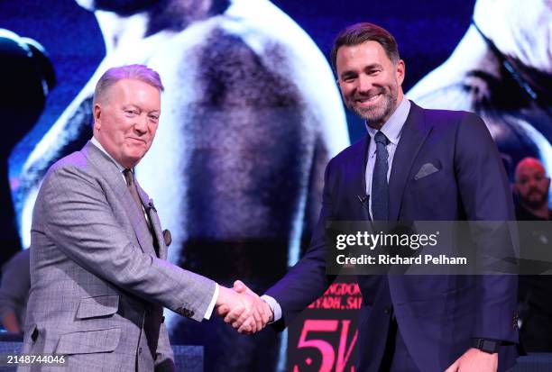 Frank Warren shake hands with Eddie Hearn during a press conference ahead of the Artur Beterbiev and Dmitrill Bivol WBA, WBC, IBF & WBO Light...