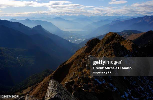 hazy autumn view on the swiss alps - kanton tessin stock-fotos und bilder