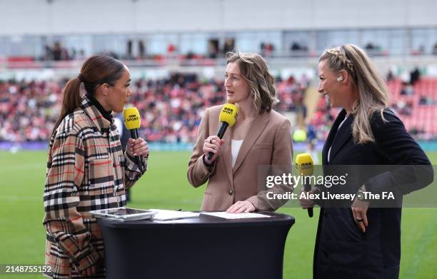 Alex Scott, BBC Sport presenter talks with pundits Ellen White and Rachel Brown-Finnis prior to the Adobe Women's FA Cup Semi Final match between...