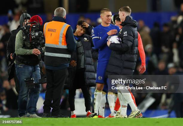 Alfie Gilchrist interacts with teammate Cole Palmer of Chelsea following victory in the Premier League match between Chelsea FC and Everton FC at...