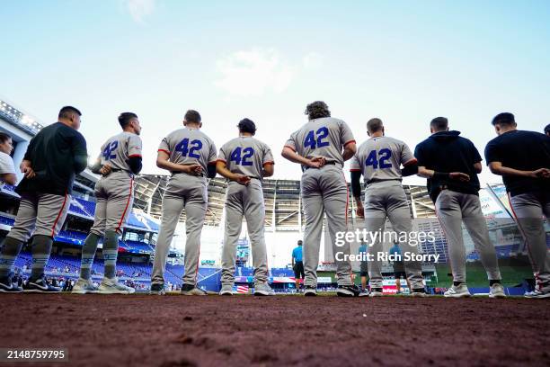 San Francisco Giants players line up for the national anthem prior to a game against the Miami Marlins at loanDepot park on April 15, 2024 in Miami,...