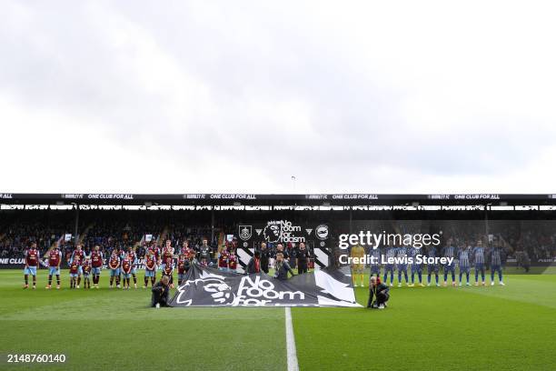 General view inside the stadium as players of both side's line up in-front of a No Room for Racism handshake board prior to the Premier League match...