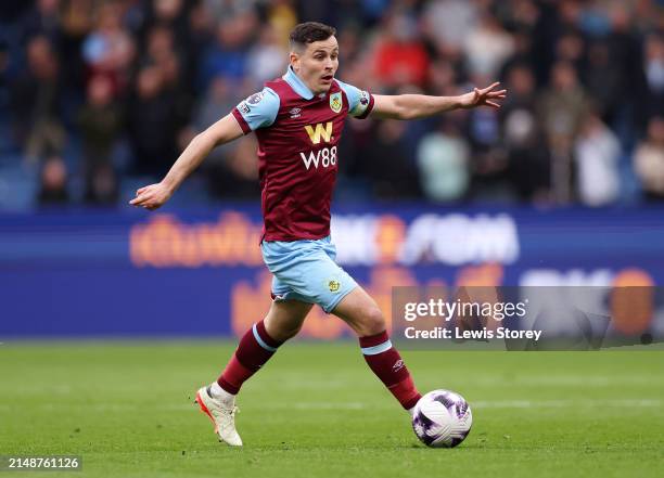 Josh Cullen of Burnley runs with the ball during the Premier League match between Burnley FC and Brighton & Hove Albion at Turf Moor on April 13,...