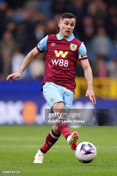 Josh Cullen of Burnley runs with the ball during the Premier League match between Burnley FC and Brighton & Hove Albion at Turf Moor on April 13,...
