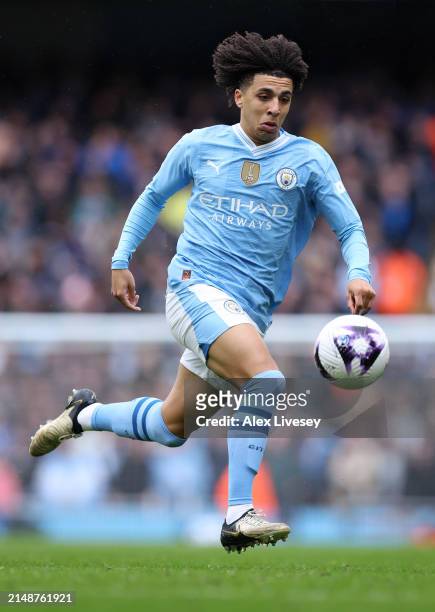 Rico Lewis of Manchester City runs with the ball during the Premier League match between Manchester City and Luton Town at Etihad Stadium on April...