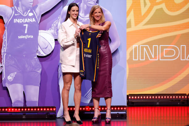 Caitlin Clark poses with WNBA Commissioner Cathy Engelbert after being selected first overall pick by the Indiana Fever during the 2024 WNBA Draft at...