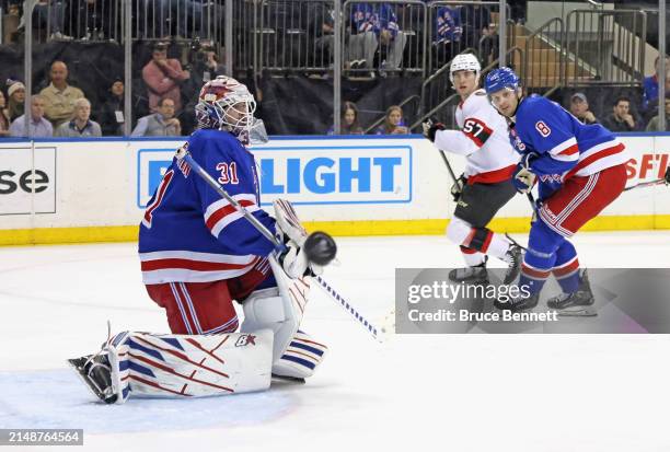 Igor Shesterkin of the New York Rangers sticks aside a first period shot during the game against the Ottawa Senators at Madison Square Garden on...