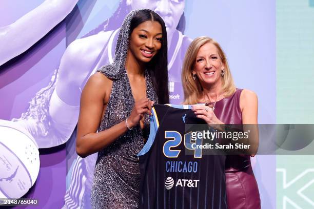 Angel Reese poses with WNBA Commissioner Cathy Engelbert after being selected seventh overall pick by the Chicago Sky during the 2024 WNBA Draft at...