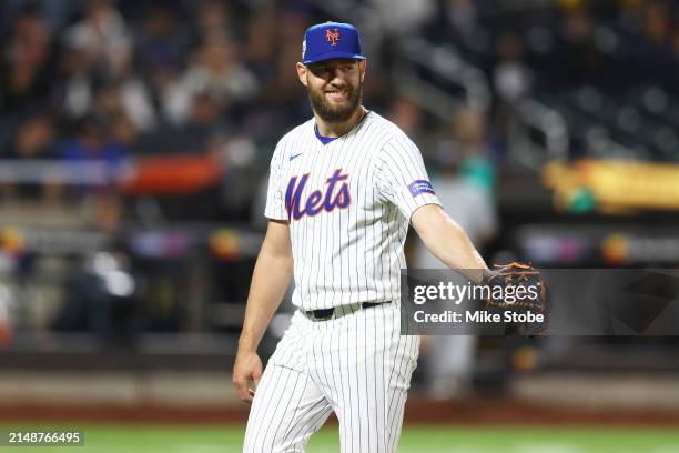 Adrian Houser of the New York Mets smiles after being removed in the top of the sixth inning against the Pittsburgh Pirates at Citi Field on April...