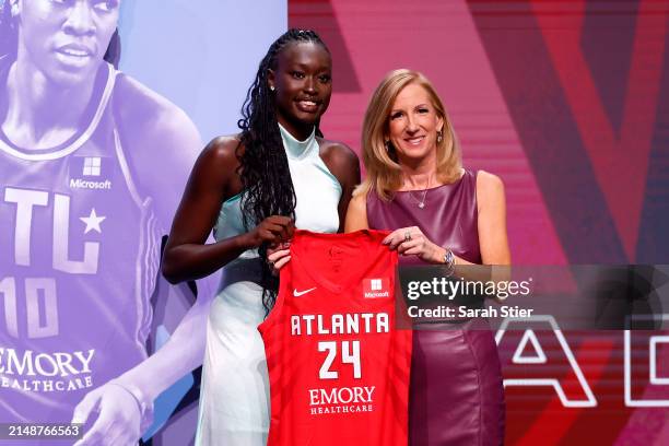 Nyadiew Puoch poses with WNBA Commissioner Cathy Engelbert after being selected 12th overall pick by the Atlanta Dream during the 2024 WNBA Draft at...