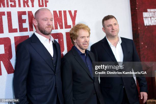 Ivan Atkinson, Jerry Bruckheimer and John Friedberg attend the premiere of "The Ministry Of Ungentlemanly Warfare" at AMC Lincoln Square Theater on...