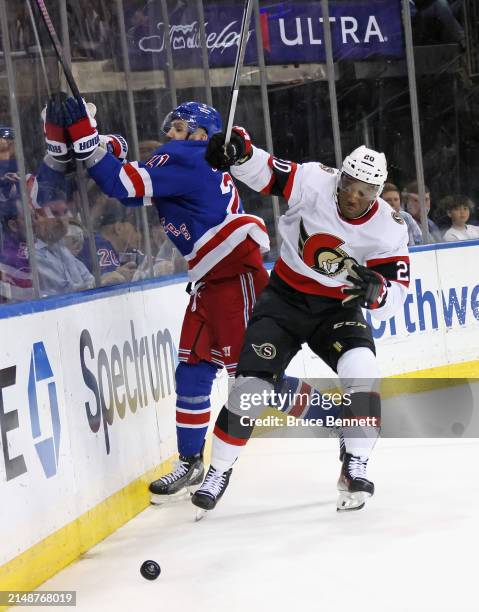 Bokondji Imama of the Ottawa Senators checks Barclay Goodrow of the New York Rangers during the second period at Madison Square Garden on April 15,...