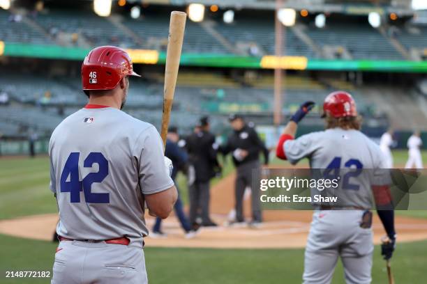 Paul Goldschmidt and Brendan Donovan of the St. Louis Cardinals prepare to bat against the Oakland Athletics in the first inning at Oakland Coliseum...