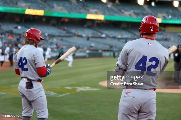 Paul Goldschmidt and Brendan Donovan of the St. Louis Cardinals prepare to bat against the Oakland Athletics in the first inning at Oakland Coliseum...