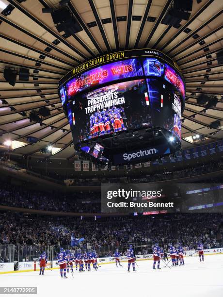 The New York Rangers celebrate their win against the Ottawa Senators as they win the President's Trophy for best record in the league at Madison...