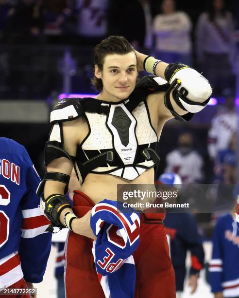 Matt Rempe of the New York Rangers takes part in fan appreciation night following a win against the Ottawa Senators at Madison Square Garden on April...