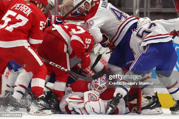 Sam Montembeault of the Montreal Canadiens makes a third period save on a shot from Alex DeBrincat of the Detroit Red Wings at Little Caesars Arena...