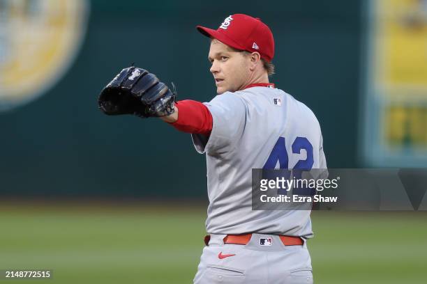 Sonny Gray of the St. Louis Cardinals points back towards catcher Willson Contreras after Contreras threw out a base runner against the Oakland...