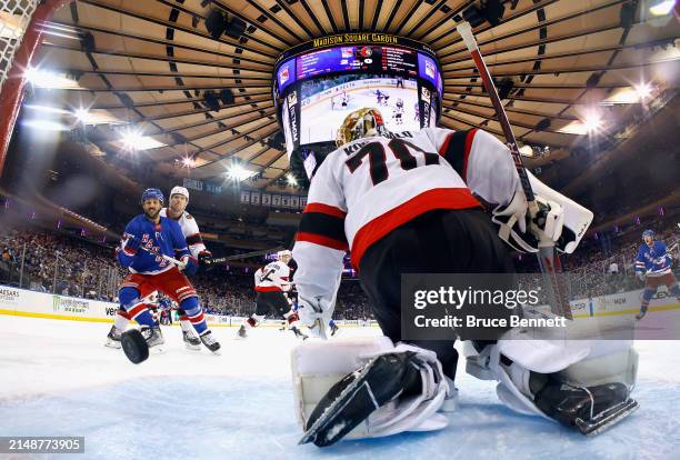 Vincent Trocheck of the New York Rangers watches a shot by Artemi Panarin get past Joonas Korpisalo of the Ottawa Senators at 4:34 of the third...