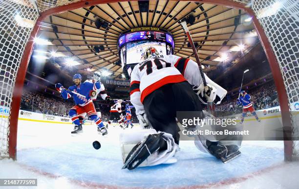Vincent Trocheck of the New York Rangers watches a shot by Artemi Panarin get past Joonas Korpisalo of the Ottawa Senators at 4:34 of the third...