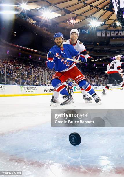 Vincent Trocheck of the New York Rangers watches a shot by Artemi Panarin get past Joonas Korpisalo of the Ottawa Senators at 4:34 of the third...