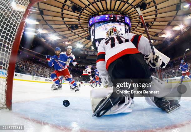 Vincent Trocheck of the New York Rangers watches a shot by Artemi Panarin get past Joonas Korpisalo of the Ottawa Senators at 4:34 of the third...