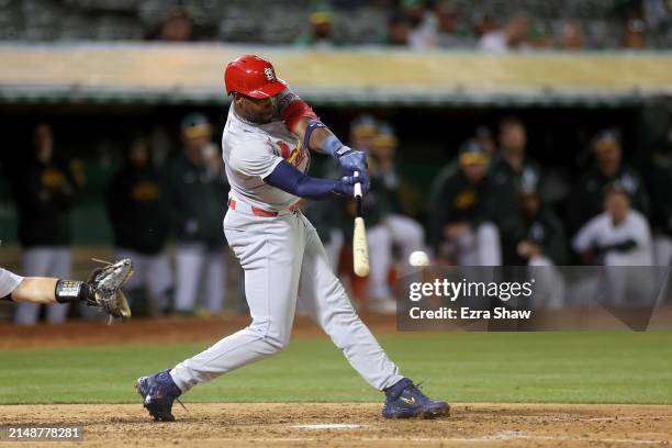 Jordan Walker of the St. Louis Cardinals hits a single that scored a run against the Oakland Athletics in the sixth inning at Oakland Coliseum on...