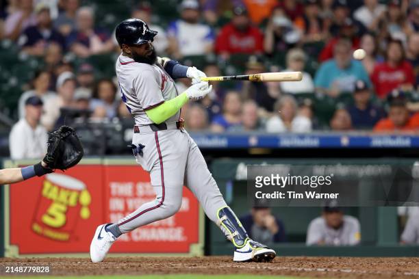 Marcell Ozuna of the Atlanta Braves hits an RBI single in the ninth inning against the Houston Astros at Minute Maid Park on April 15, 2024 in...