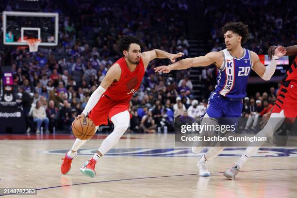 Justin Minaya of the Portland Trail Blazers drives to the basket against Colby Jones of the Sacramento Kings in the fourth quarter at Golden 1 Center...