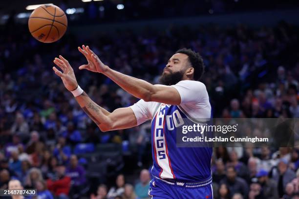 JaVale McGee of the Sacramento Kings passes the ball in the fourth quarter against the Portland Trail Blazers at Golden 1 Center on April 14, 2024 in...