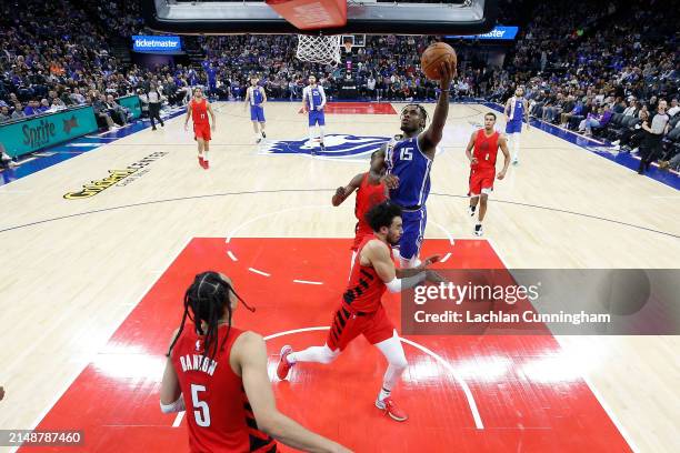 Davion Mitchell of the Sacramento Kings goes to the basket against Justin Minaya of the Portland Trail Blazers in the fourth quarter at Golden 1...