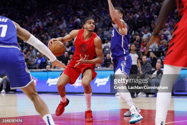 Rayan Rupert of the Portland Trail Blazers is guarded by Chris Duarte of the Sacramento Kings in the fourth quarter at Golden 1 Center on April 14,...