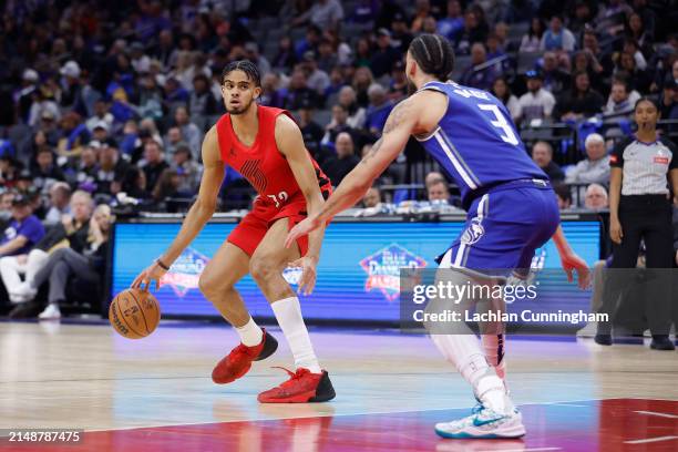 Rayan Rupert of the Portland Trail Blazers is guarded by Chris Duarte of the Sacramento Kings in the fourth quarter at Golden 1 Center on April 14,...