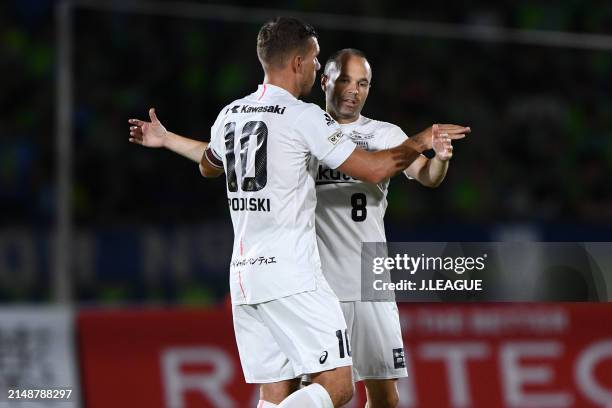 Lukas Podolski and Andres Iniesta of Vissel Kobe celebrate the team's 2-0 victory in the J.League J1 match between Shonan Bellmare and Vissel Kobe at...