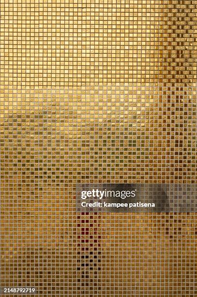 the gold wall background is very shiny and has a lot of detail - perforated metal texture stock pictures, royalty-free photos & images