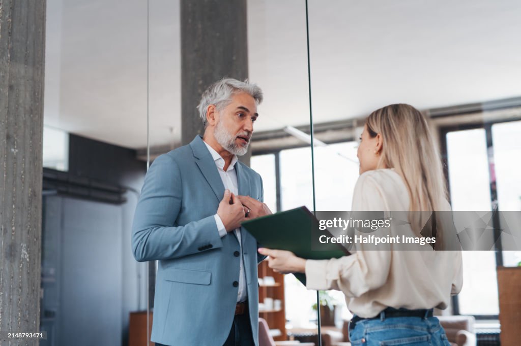 Manager scolding employee in modern office. Project manager making mistake. Company director is angry, dissatisfied for worker's poor quality work and missed deadline.