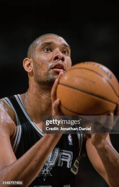 Tim Duncan, Center and Power Forward for the San Antonio Spurs prepares to shoot a free throw during the NBA Midwest Division basketball game against...