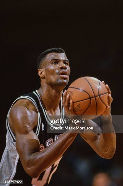 David Robinson, Center for the San Antonio Spurs prepares to shoot a free throw during the NBA Midwest Division basketball game against the Houston...