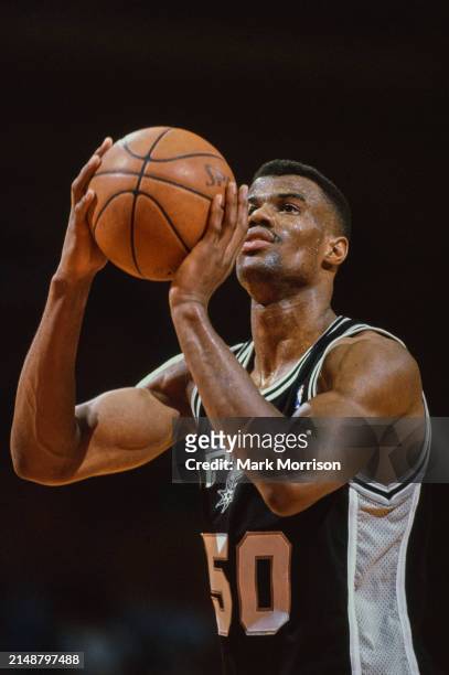 David Robinson, Center for the San Antonio Spurs prepares to shoot a free throw during the NBA Midwest Division basketball game against the Houston...