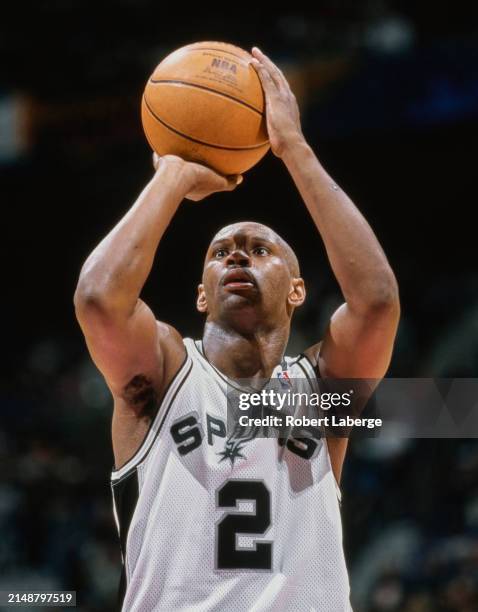 Jaren Jackson, Shooting Guard for the San Antonio Spurs prepares to shoot a free throw during the NBA Midwest Division basketball game against the...