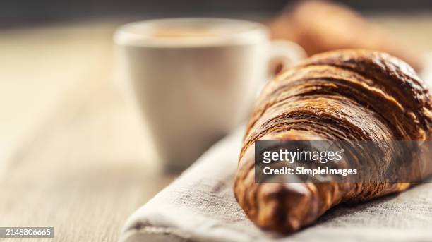 puff pastry croissant with coffee in the background. italian or french breakfast concept. - slovakia country stock pictures, royalty-free photos & images