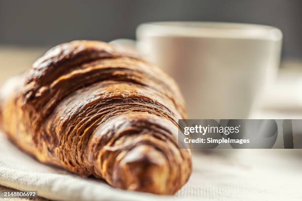 puff pastry croissant with coffee in the background. italian or french breakfast concept. - slovakia country stock pictures, royalty-free photos & images