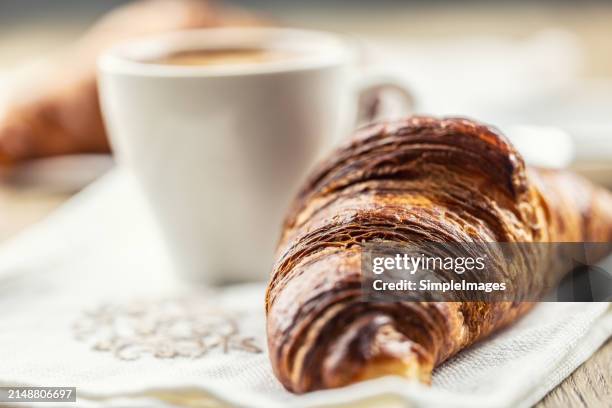 puff pastry croissant with coffee in the background. italian or french breakfast concept. - slovakia country stock pictures, royalty-free photos & images