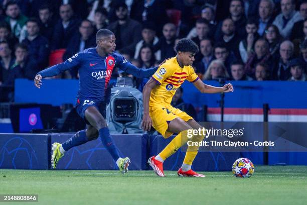 Lamine Yamal of Barcelona defended by Nuno Mendes of Paris Saint-Germain during the Paris Saint-Germain V Barcelona, UEFA Champions League,...