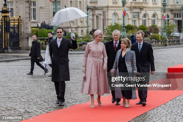 King Philippe of Belgium, Queen Mathilde of Belgium, Grand Duke Henri of Luxembourg and Grand Duchess Maria Teresa of Luxembourg listen to the...
