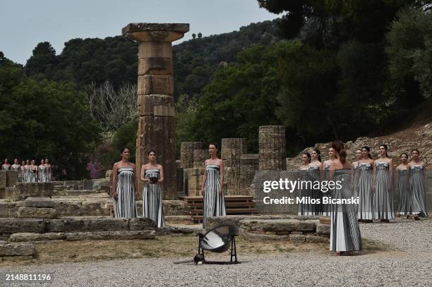 Entry of the High Priestess and the Priestesses with the Olympic Flame during the flame lighting ceremony for the Paris 2024 Summer Olympics at the...
