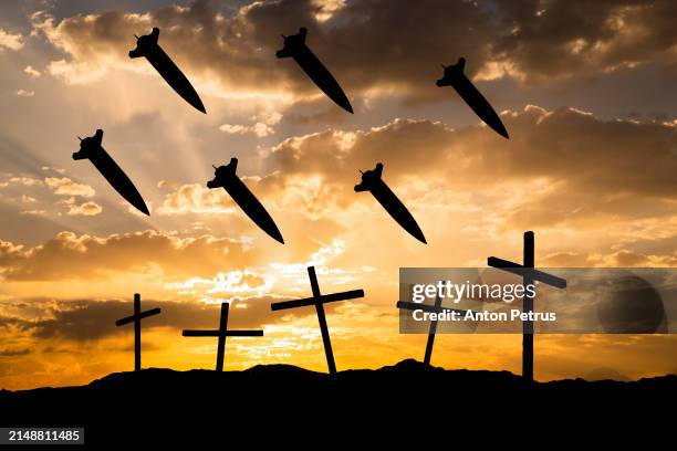 missiles above the crosses. world war iii - intercontinental ballistic missile stock pictures, royalty-free photos & images